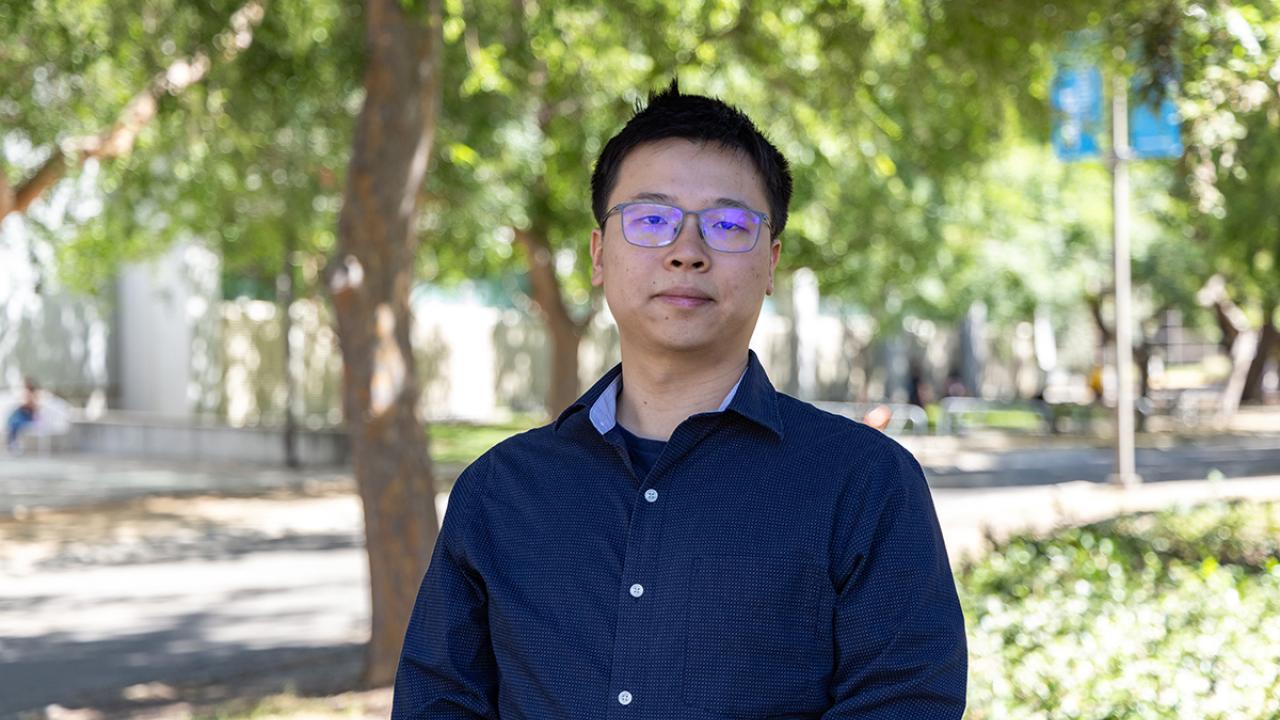 Bohan Li stands outdoors