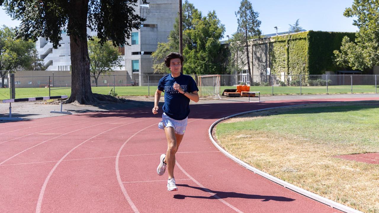 Zachary Graeber runs on a track at UC Davis
