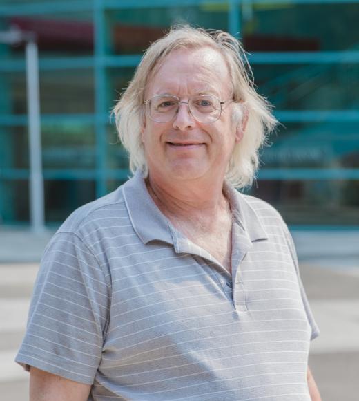 Matt Bishop standing outside of Kemper Hall