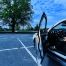 Woman using her computer in her car