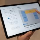 hand holding tablet device